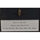 Royal Interest - an Edwardian 9ct gold, diamond and ruby presentation bar brooch,
