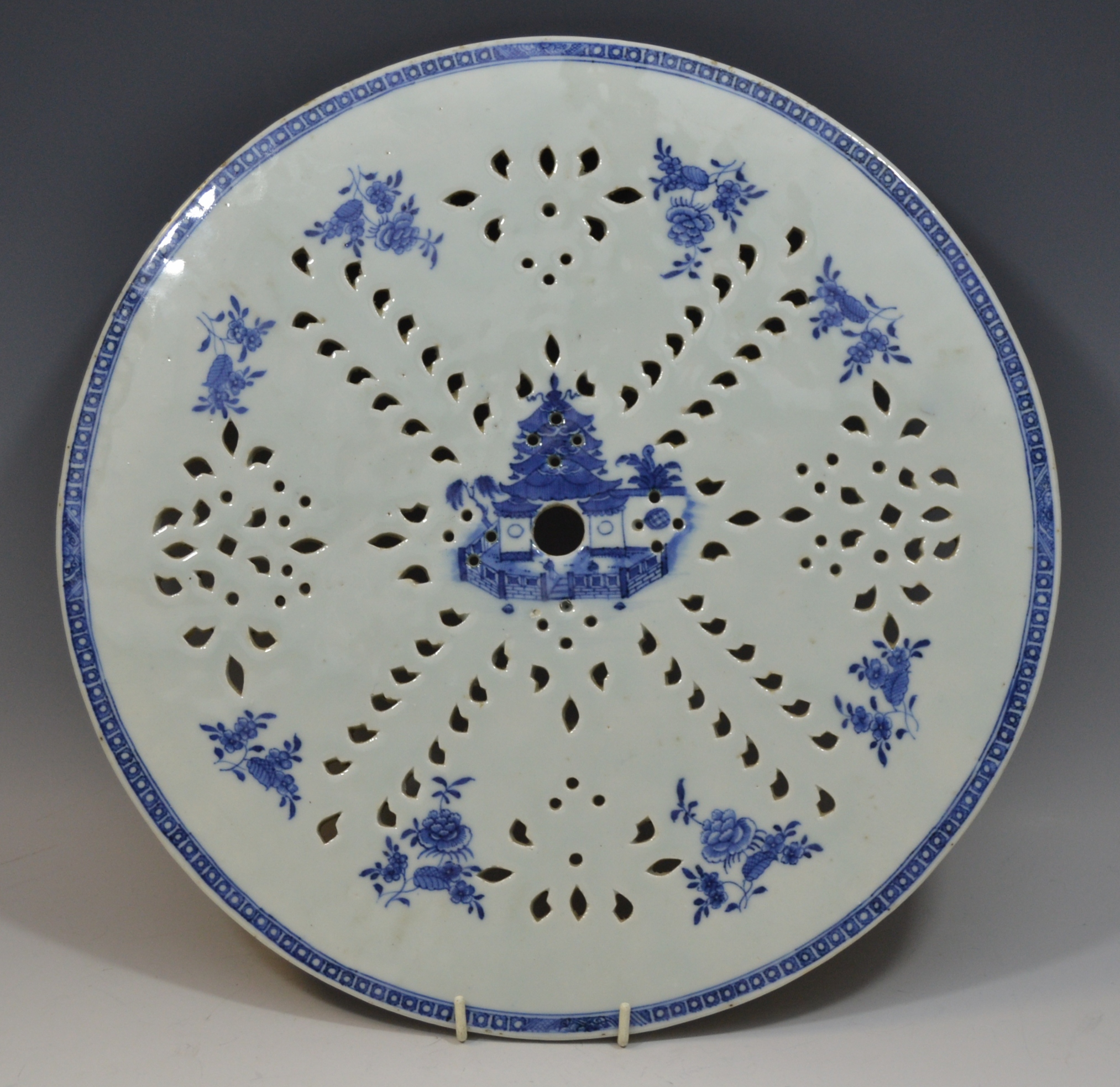 A Chinese strainer plate, pierced,