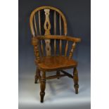 A child's elm Windsor chair, by Melvyn Tolley, Kniveton, hooped back, pierced vasular splat,