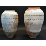 A near pair of terracotta olive pots,