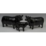 A Beswick Aberdeen Angus bull, modelled by Arthur Gredington, model no 1562; a similar cow,