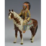 A Beswick North American Indian Chief, on skewbald pony, in full headdress, printed mark, model no.