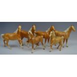 A Beswick Palomino Swish Tail horse, designed by Arthur Gredington, 21cm high, model no.