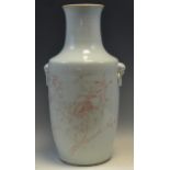 A large Chinese vase, decorated in red with outline of blossoming branches and moth,