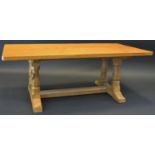 Robert Thompson, Mouseman of Kilburn - an oak coffee table, rounded rectangular adzed top,