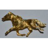 Garavelli Aldo SRL - a mid 20th century Italian 18k gold brooch, cast as a horse trotting,