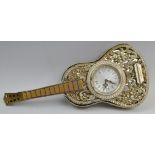 A mid 20th century novelty clock, in the form of Spanish guitar,