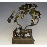 An early 20th century bronze two light table light, cast with two horse drinking from a well,