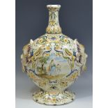 A 19th century maiolica vase, of flattened ovoid form with onion neck,