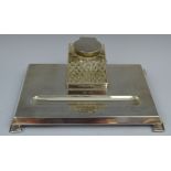 A 20th century silver rectangular standish, with square strawberry cut well, hinged cover,