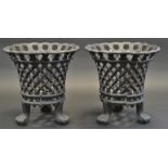 A pair of Regency style cast iron flared cylindrical pierced basketweave planters, paw feet,