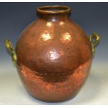 A 19th century Indian two handled copper and brass ovoid water flask, loop handles,