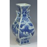 A Chinese panelled baluster vase, decorated in underglaze blue with birds in flight amongst clouds,