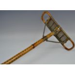 An early 20th century bamboo shooting stick, the caned seat folding for carriage,