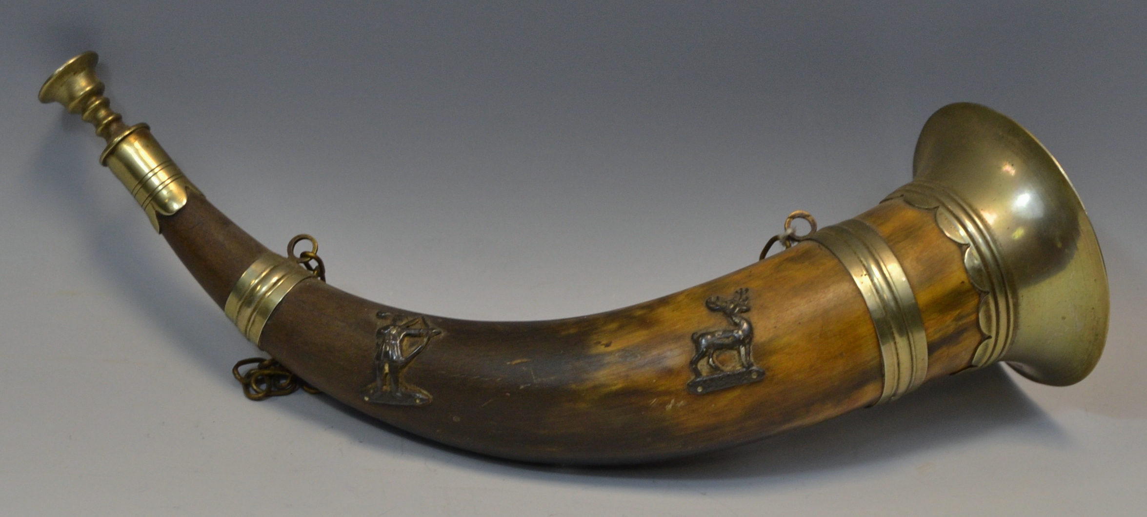 A late 19th century white metal mounted hunting horn,