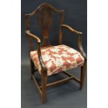 A 19th century oak Hepplewhite elbow chair, shaped back pierced vasular splat,