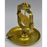 A late 18th/early 19th century brass wax jack, dished circular base, loop handle, 18cm high, c.