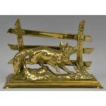 An early 20th century brass letter rack, cast with a fox before a three bar fence,. 17.