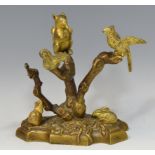 A 19th century gilt metal mantel model, of a squirrel and two birds perched in a tree,