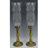 A pair of early 20th century brass storm lanterns, etched glass shades,