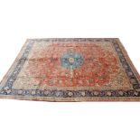 A Mahal carpet, the madder field in tones of cream , terracotta and blue, conforming border,