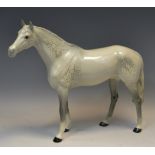 A Beswick dapple grey mare, standing, 29cm high,