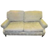 A contemporary two seater sofa, upholstered in Bird egg blue damask , turned mahogany legs,