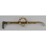 Hunting Interest - an early 20th century gold coloured metal riding crop stick pin,