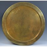 An East European/Russian Orthodox communion plate, engraved with cross and scrolling foliage,