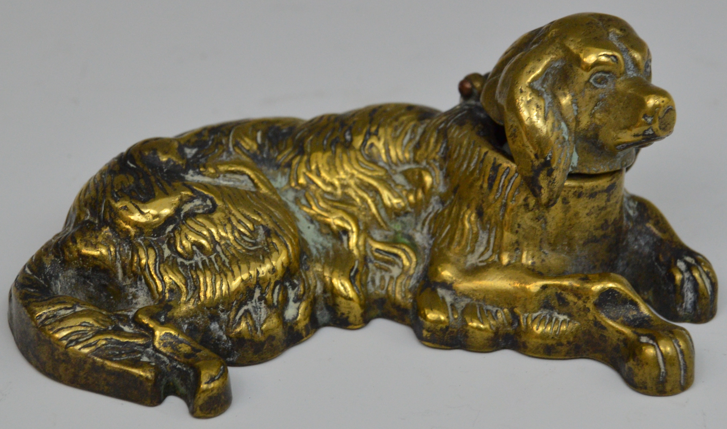 A 19th century brass novelty inkwell, as a Golden Retriever, reclining,