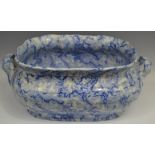 A 19th century Staffordshire two handled foot bath, decorated with fronds in tones of blue,