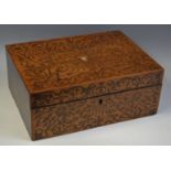 A 19th century rectangular mahogany work box, inlaid to cover and front with scrolling foliage,