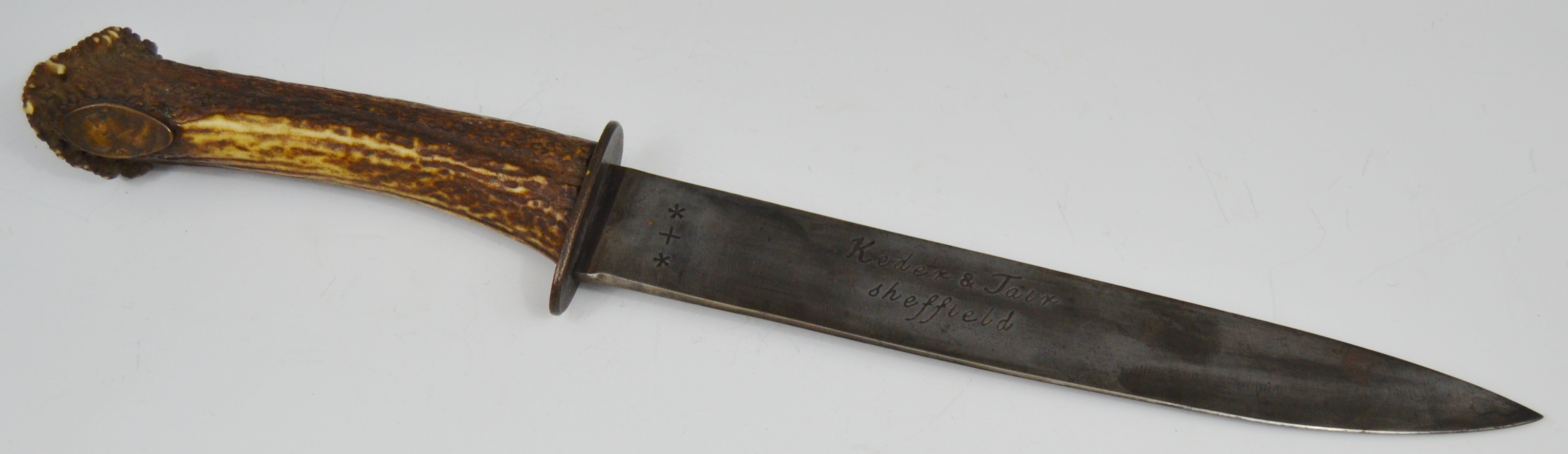 A 19th century hunting knife, the 29cm blade inscribed Defender, the verso Keder & Jair Sheffield,