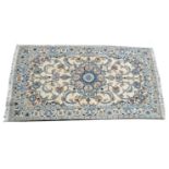 A Nain carpet in tones of midnight blue and cream,