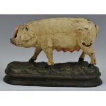 A 19th century cast iron door stop, as a sow, cold painted, 20.