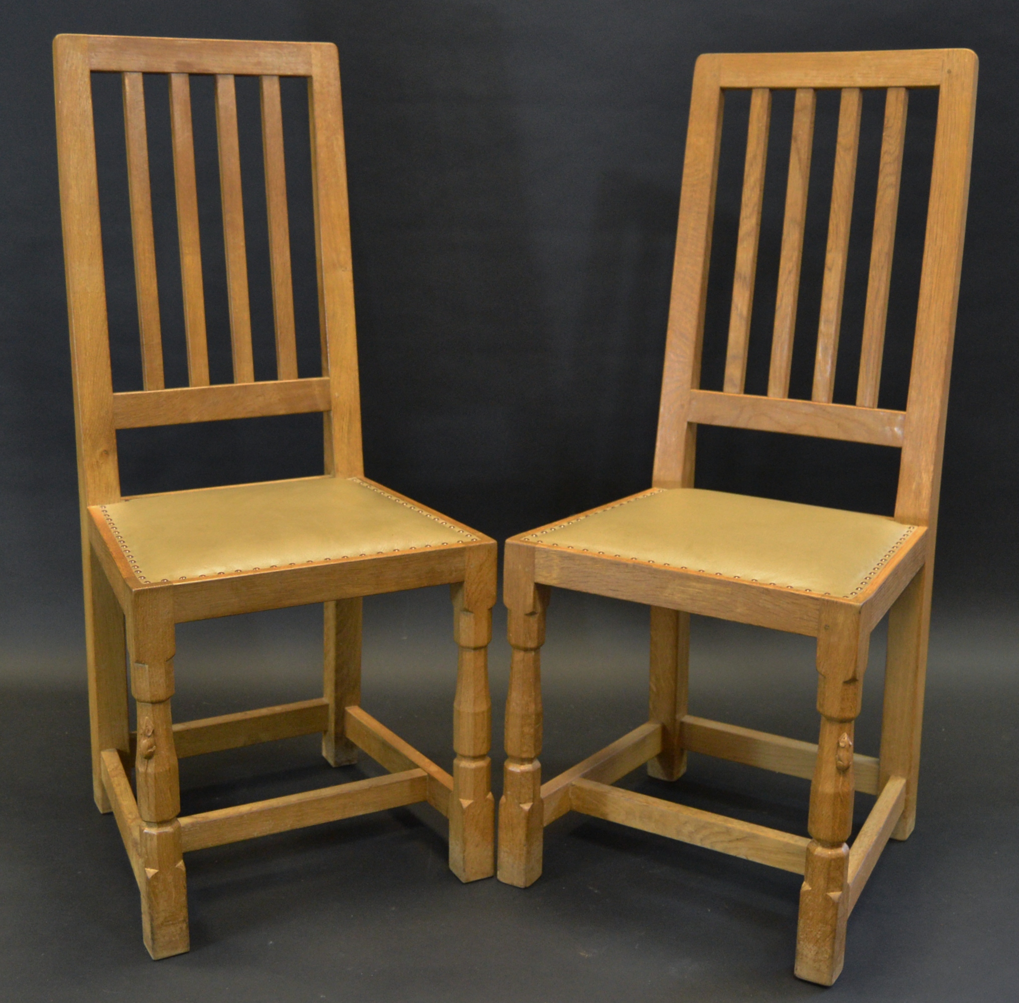 Robert Thompson, Mouseman of Kilburn - a pair of oak dining chairs, rectangular slatted backs,