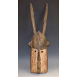 Tribal Art - an African mask, domed forehead with central ridge and lofty 'horns',