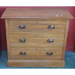 An Edwardian satinwood chest of three drawers. 84cm high x 99cm wide x 50cm deep.