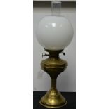 An early 20th century lacquered brass oil lamp, fluted columnar pedestal,