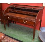 A George III mahogany tambour front cylinder desk, of large proportions,