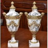 A pair of Louis XVI Revival gilt-metal mounted Breccia marble manel urns,