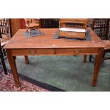 An Arts and Crafts oak writing table