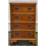 A reproduction yew veneered chest of four drawers. 73cm high x 44cm wide x 32.5cm deep.