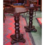 A pair of bar high tables, circular top, turned column, quatrefoil base, bun feet, 105cm high,