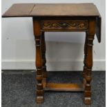 A Jacobean revival oak drop-leaf side table of small proportions, 58cm tall, 41cm wide.