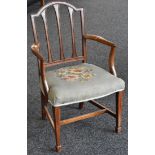 A George III mahogany open armchair, arched top rail, outswept arms, stuffed overseat,