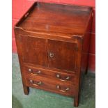 A George III mahogany tray-top night cupboard, three-quarter gallery with pierced carrying handles,