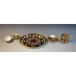 A Royal Crown Derby miniature 1128 pattern tea set on oval tray