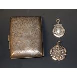 A Victorian silver cigarette case, Birmingham 1899; a silver sporting medal,