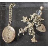 Jewellery - a silver charm bracelet suspending five charms inc crystal globe, pram,